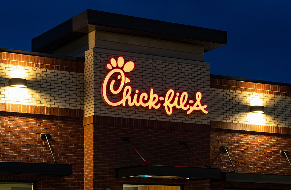 Chick-fil-A Fast Food Restaurant sign at night.