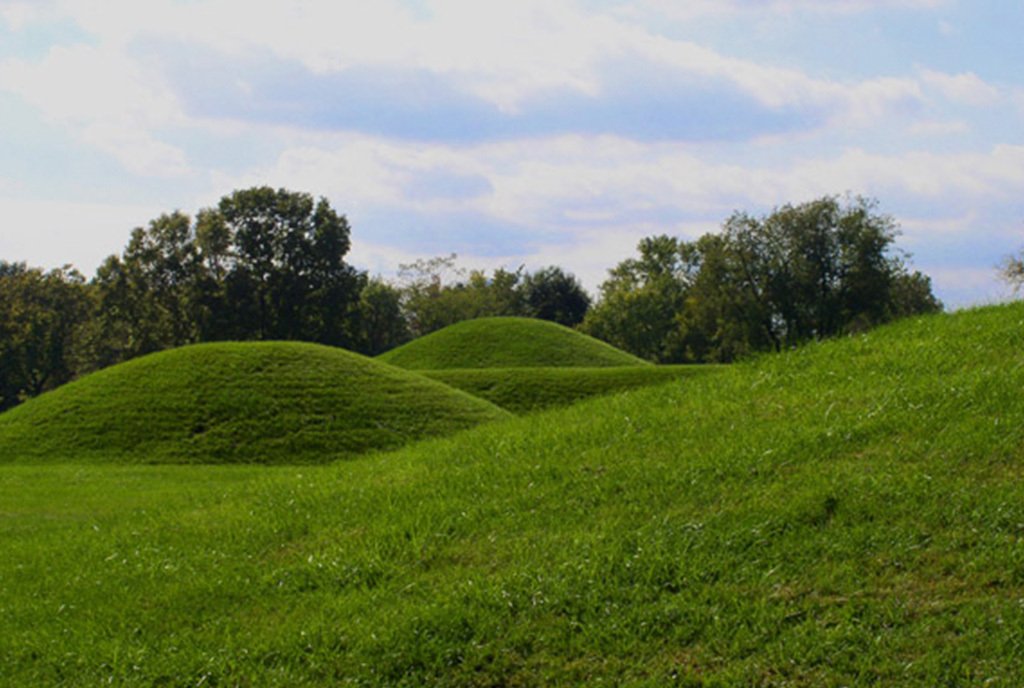 Large, grass-covered Hopewell mounds from the Mound City group in Ohio, United States.