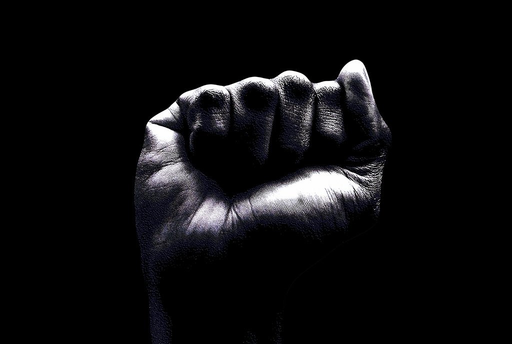 A black and white photo of a closed fist