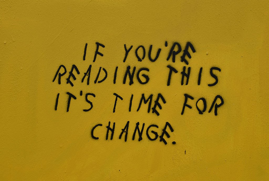 A spray-painted message reading, “If you’re reading this, It’s time for change” in the style of the similarly titled Drake album.