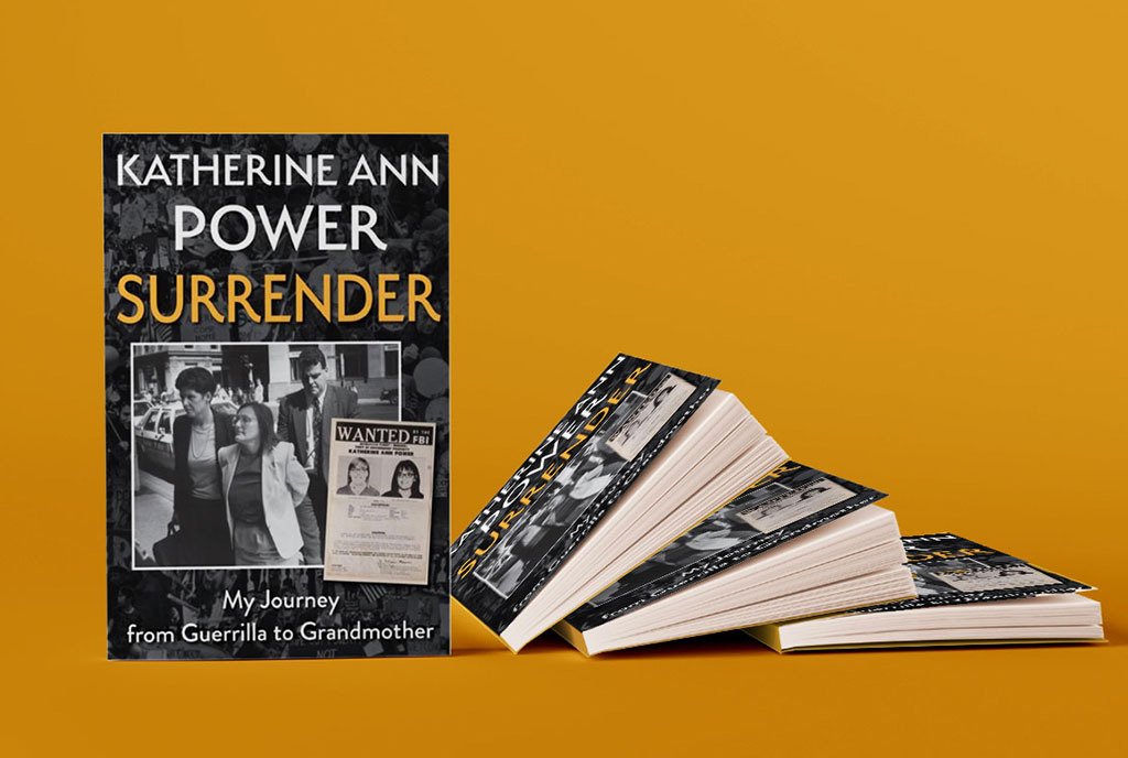 A stack of the author’s books, “Surrender: My Journey from Guerrilla to Grandmother”