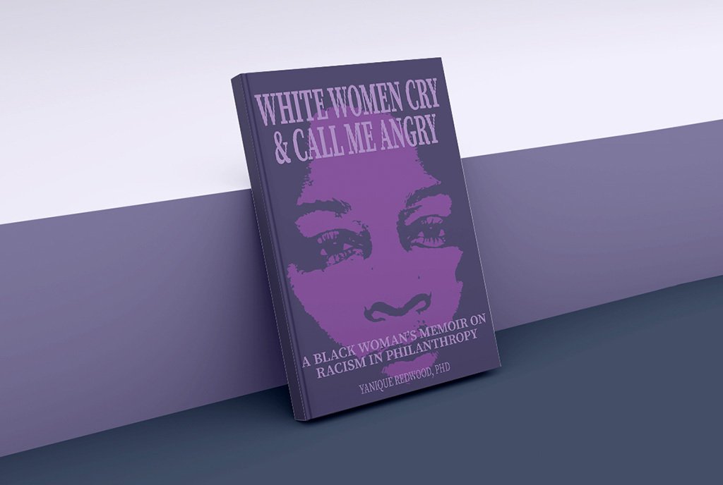 Yanique Redwood’s book, “White Women Cry & Call Me Angry: A Black Woman's Memoir on Racism in Philanthropy” leaning against a wall