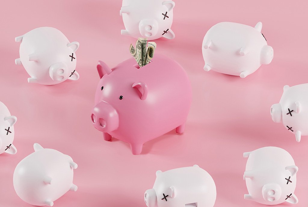 One large piggy bank surrounded by smaller, fallen-over piggy banks with Xs over their eyes.