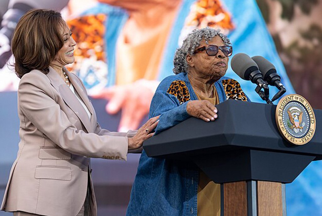 Opal Lee, the “Grandmother of Juneteenth” standing at a White House podium and accompanied by Vice President of the United States, Kamala Harris.