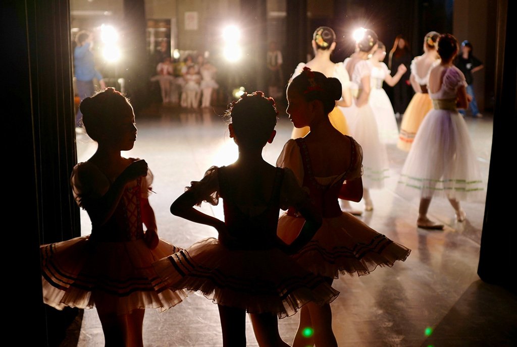 Girls in tutus waiting backstage at a Ballet Academy, one of the many types of art programs that lost funding with Governor Ron DeSantis’s cultural grants veto.