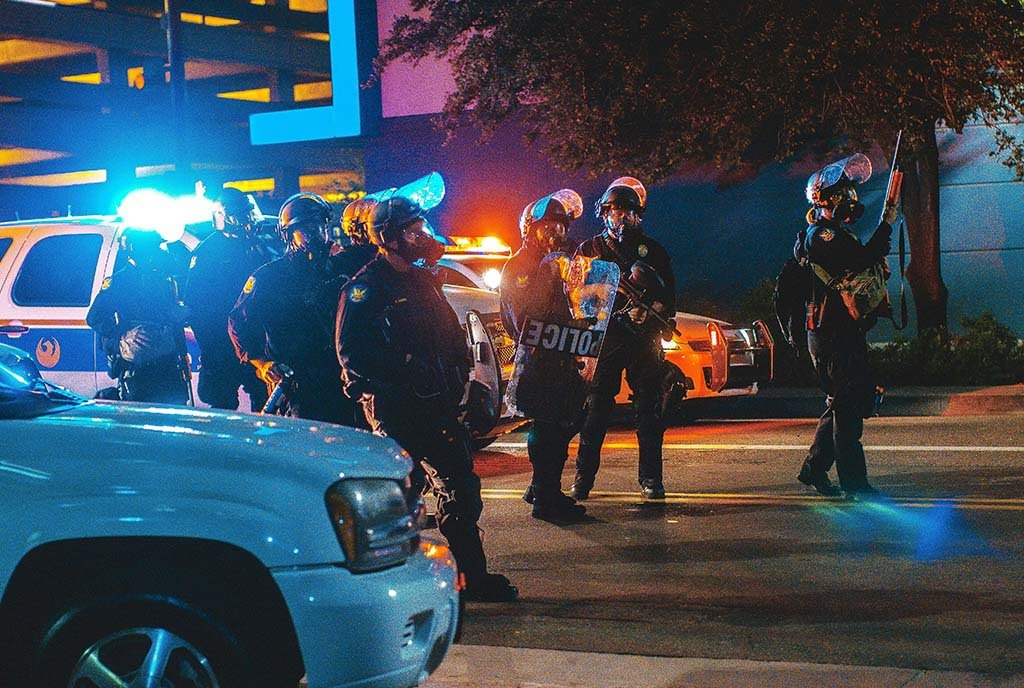 Police officers attempting to disperse an anti-Trump protest in Phoenix, AZ