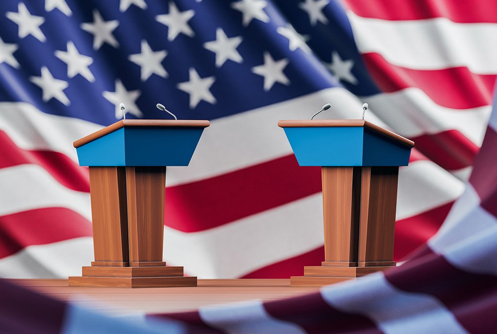 Two empty debate podiums facing each other while tangles in the folds of an American flag, symbolizing the absence of critical conversations about economic democracy during the debate.