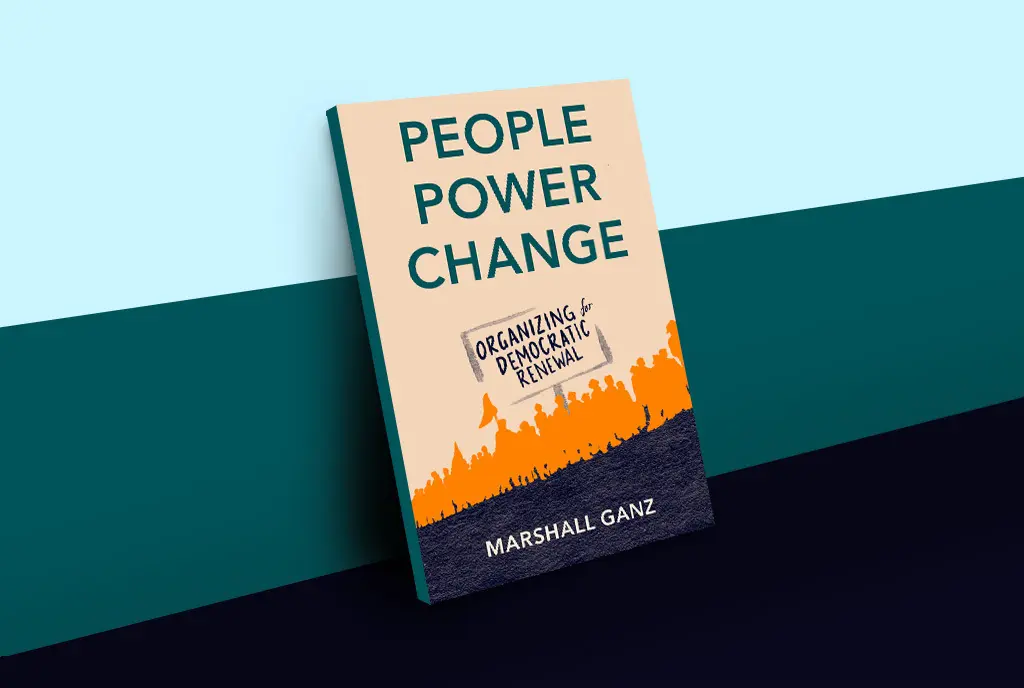 The interviewee’s book, People, Power, Change: Organizing for Democratic Renewal against a blue background.