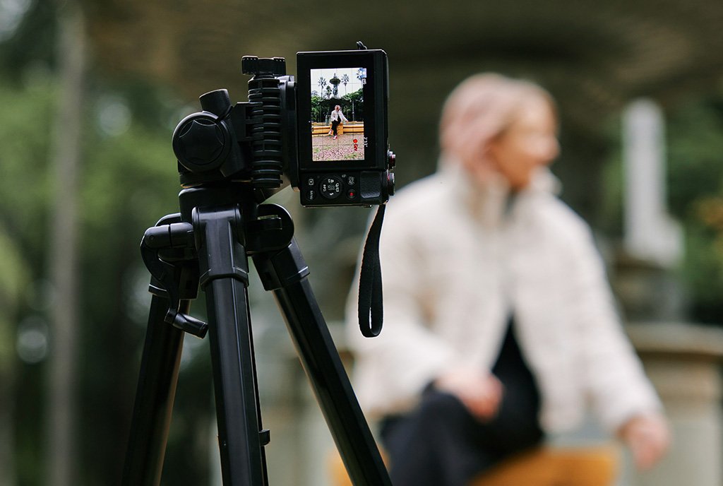 A nonprofit worker recording a microvlog, illustrating the power of digital advocacy as a proactive resilience strategy.