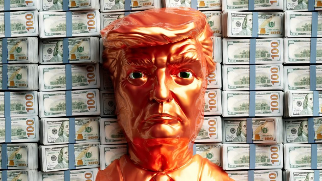 A golden statue of Donald Trump’s head before stacks of US money.