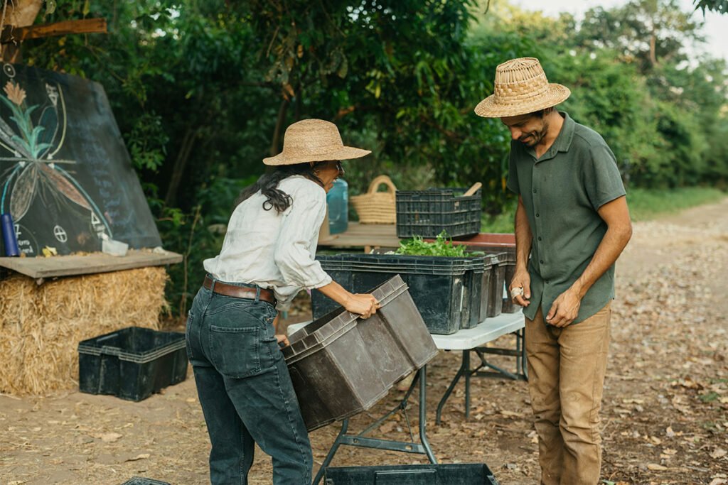 Farmers working the land together in Central America, emphasizing land stewardship and reciprocity.