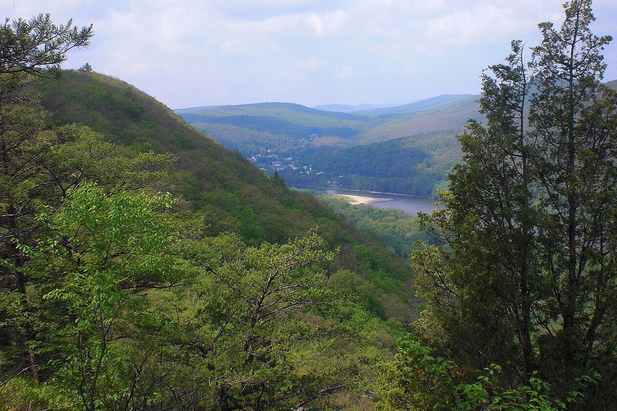 A mountainous landscape dipping down into a picturesque Susquehanna River. Viewed from the Mocanaqua Loop Trail in Conyngham Township, Luzerne County, PA.