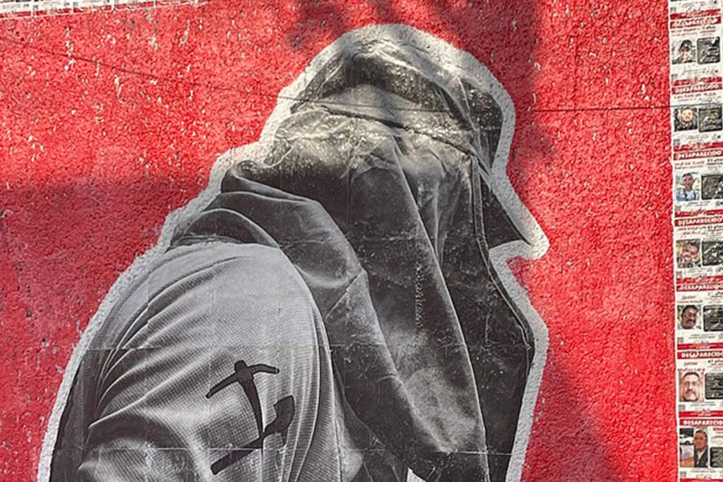 A black and white paste-up image of a day-laborer wearing a sun hat and looking away from the camera. The image is surrounded by missing posters of day laborers. Guadalajara, Jalisco, México.