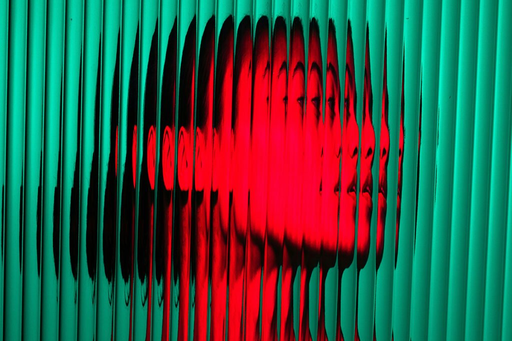 A fragmented image of a woman’s profile, symbolizing how women’s rights and protections are under seige.