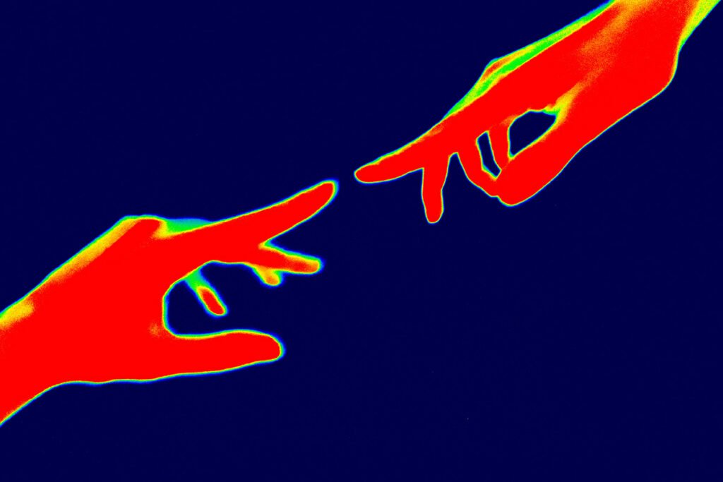 A heat map image of two hands nearly touching fingers, symbolizing closing a gap in alignment.