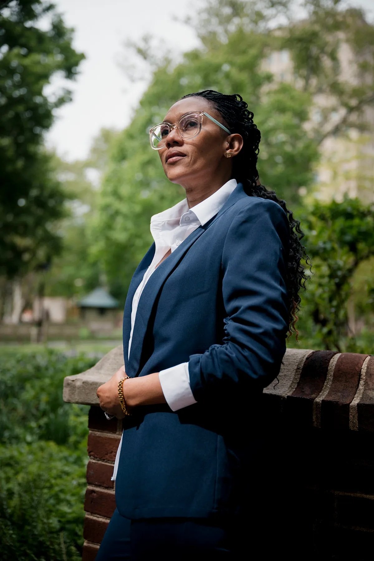 Adriana George stands for a portrait at Washington Square Park in Philadelphia on April 29, 2026. Adriana George stands for a portrait in Philadelphia. A former nanny, George now advocates on behalf of Black, Afro-Latina and Caribbean domestic workers in Pennsylvania. (Hannah Yoon for The 19th)