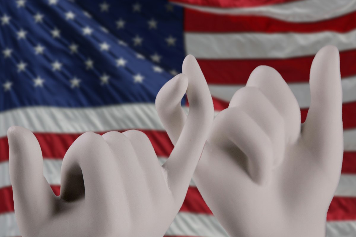 Two ceramic hands with pinkies wound into a “promise” gesture, posed in front of an American flag