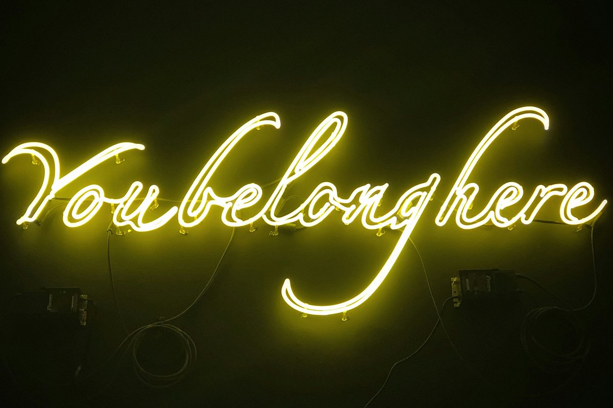 A neon lights sign that reads, “You Belong Here”