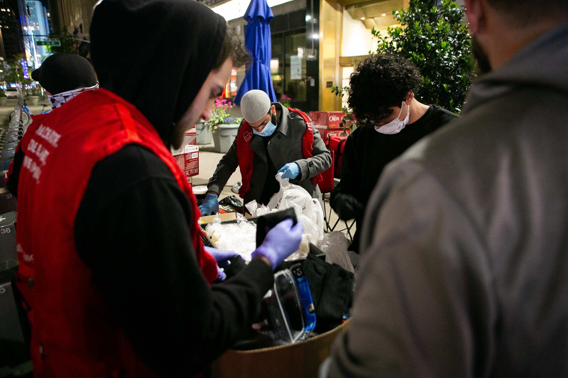 Giving back | American Muslim Experience documentaryVolunteers with "Muslims Giving Back" packing and distributing food and other essentials to the unhoused. The non-profit started post 9/11 in an effort of change the narrative on what Muslims are all about. Photography by Syed Yaqeen.
