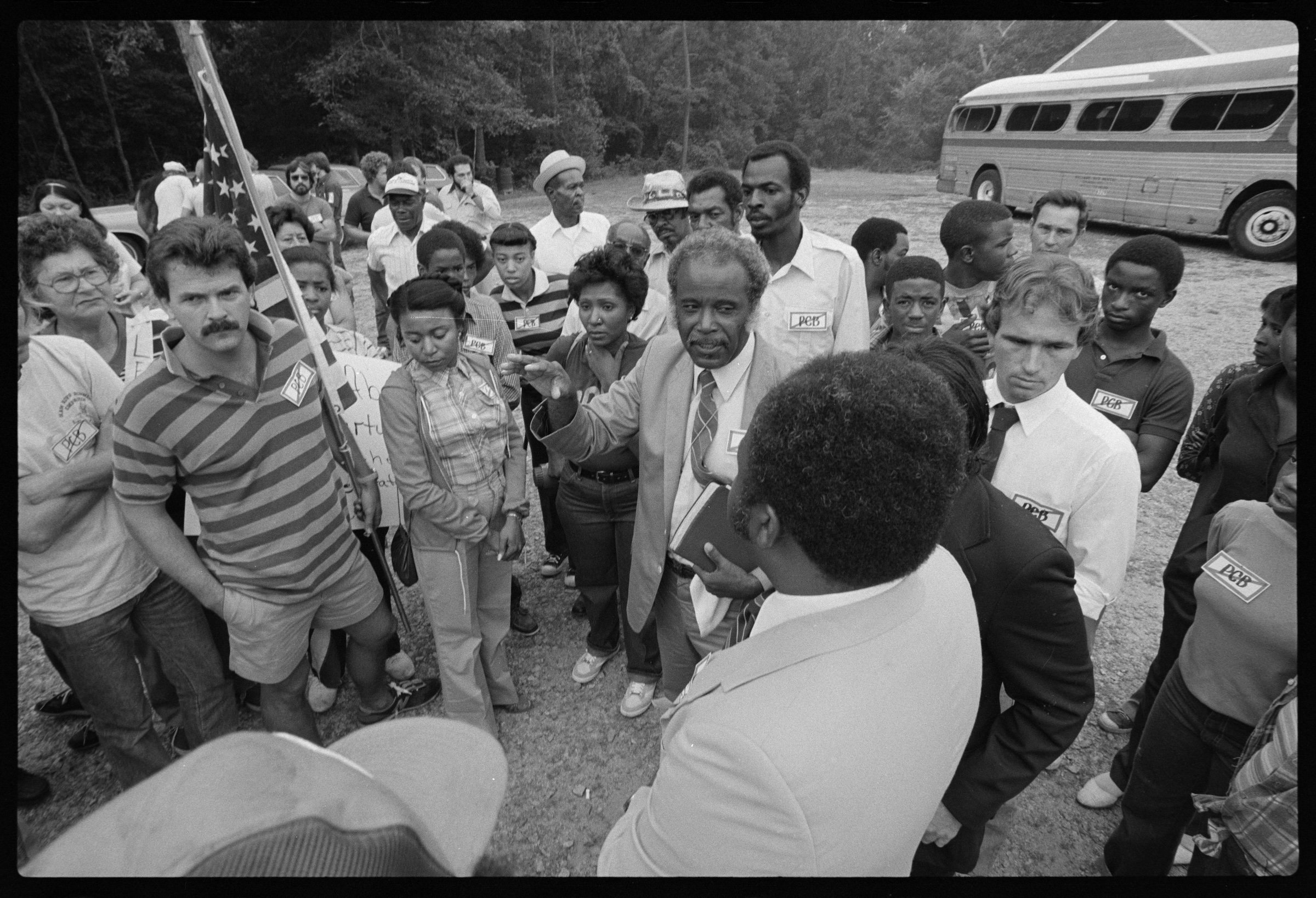Dollie Burwell (center, holding her hand against her neck) gathering with others to protest in Warren County, NC, 1982. Credit: The Jerome Friar Photographic Collection and Related Materials, Wilson Library, UNC-Chapel Hill, used with permission.