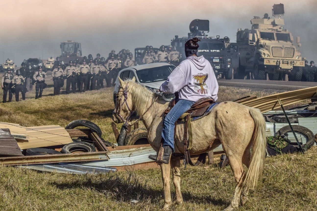 “Defend the Sacred.” Standing Rock, Cannon Ball, North Dakota, 2016. Ryan Vizzions.