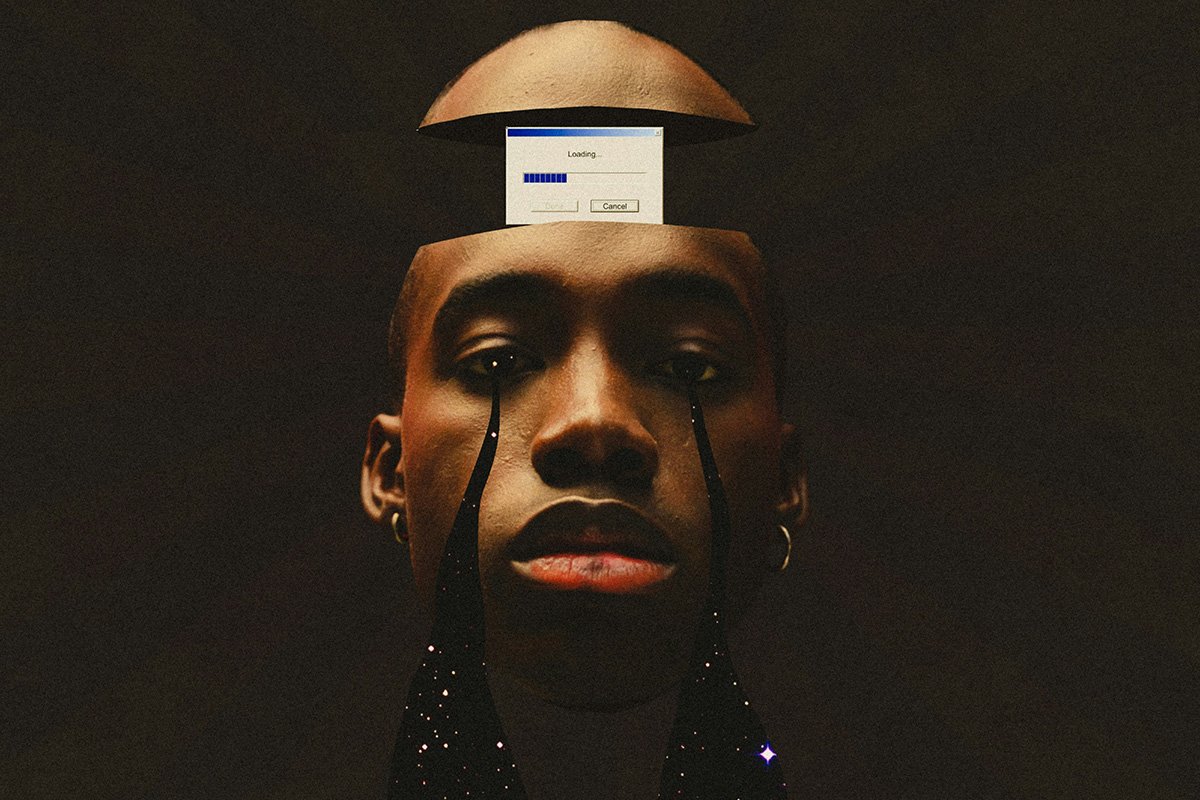 With a stream of galactic tears coming down his face. His head is split in half with a old school computer loading sign.