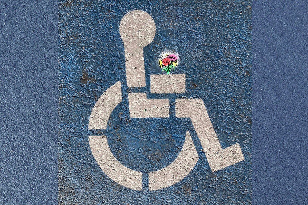 An International Symbol of Access (ISA) painted onto a blue textured background with a bouquet of flowers spraypainted in the symbol’s hands.