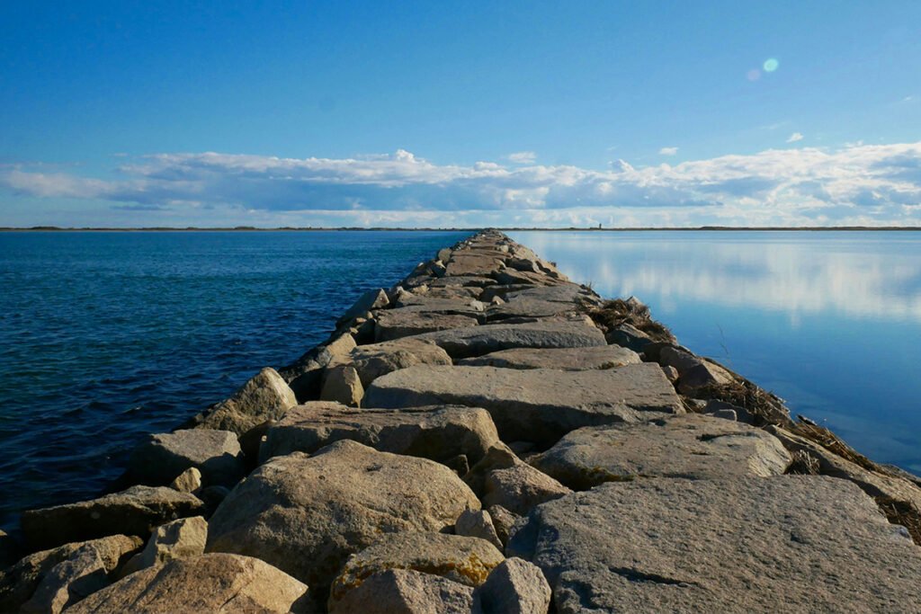 A strong and resilient seawall made of large boulders and rocks in Provincetown, MA, USA.