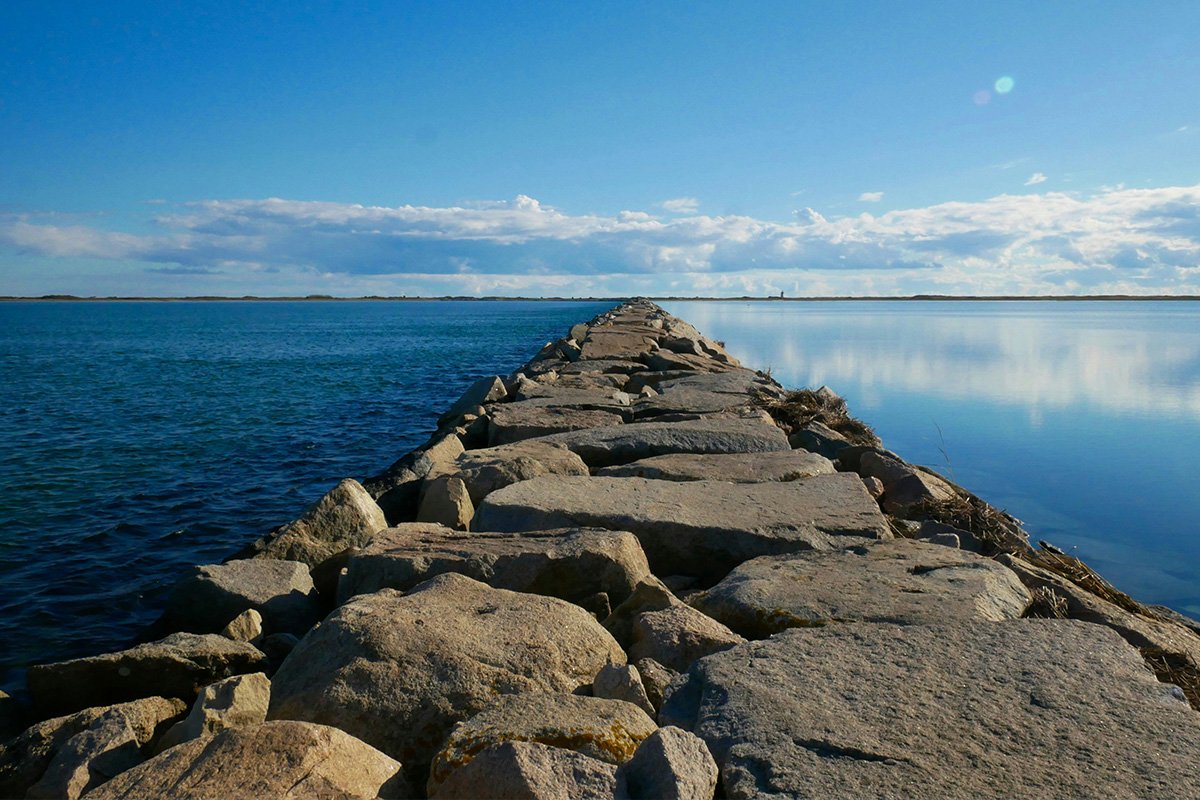 A strong and resilient seawall made of large boulders and rocks in Provincetown, MA, USA.